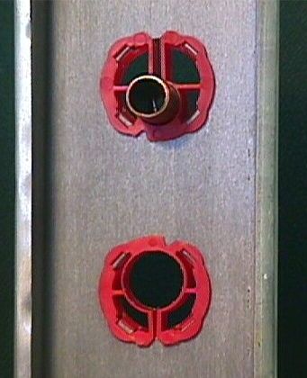 A 3/4" Pipetyte and a 1/2" Pipetytes with a tube in a metal stud.   Click on photo to download a pdf file about Pipe-Tytes.